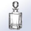 Crystal decanter trophy with faceted design and round stopper, clear glass, ideal for corporate or milestone recognition.