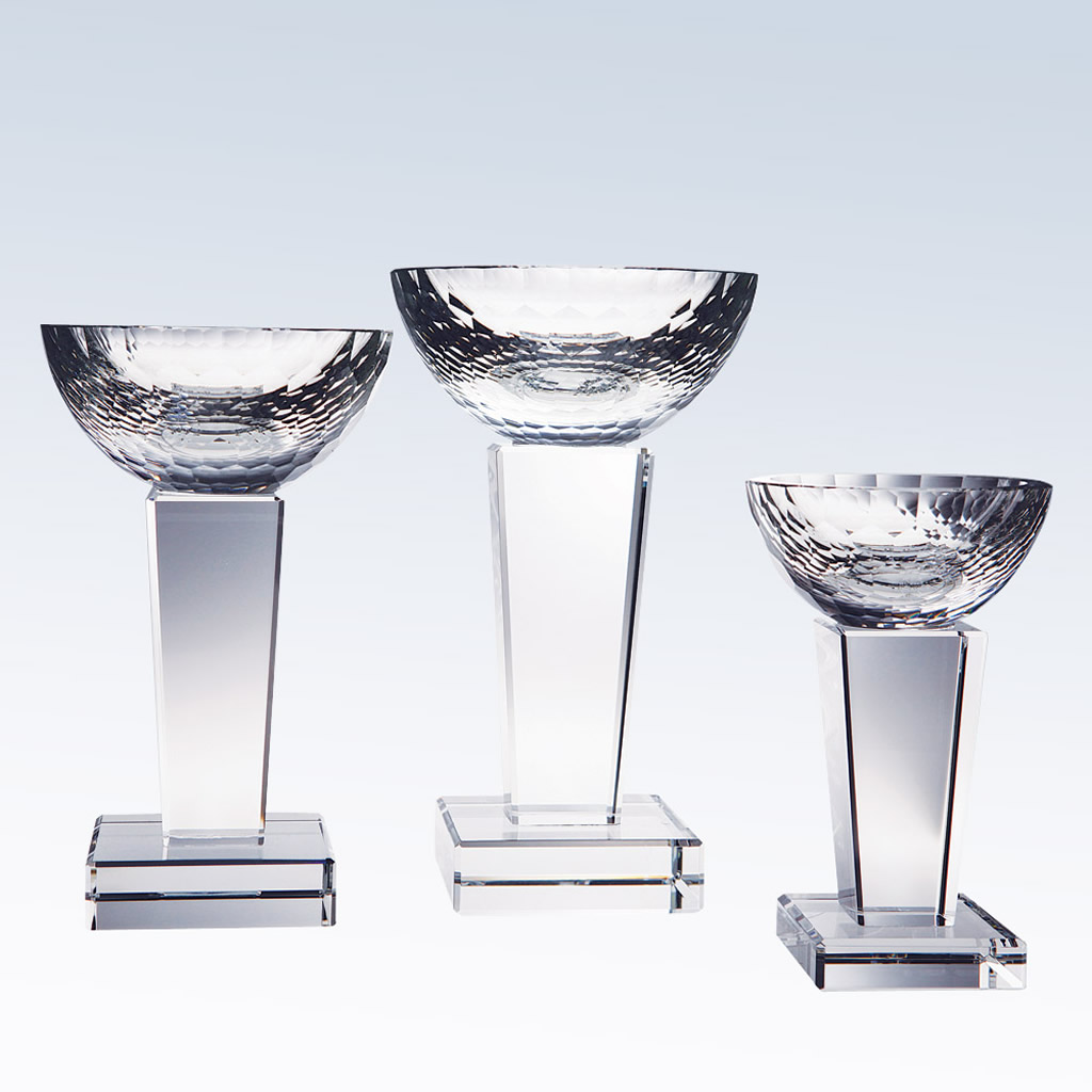 Crystal trophy cups in three heights with textured bowls and clear bases, suitable for corporate or achievement awards.