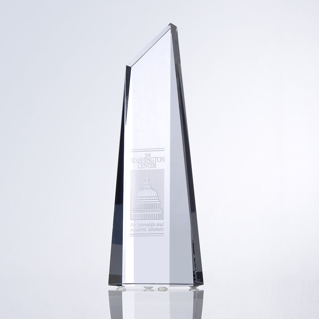 Clear crystal obelisk award with engraved U.S. Capitol dome and "The Washington Center" text, ideal for corporate recognition.