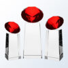 Red Diamond Slant Crystal Trophy with red gem top, glass base; ideal for corporate recognition or achievement awards.