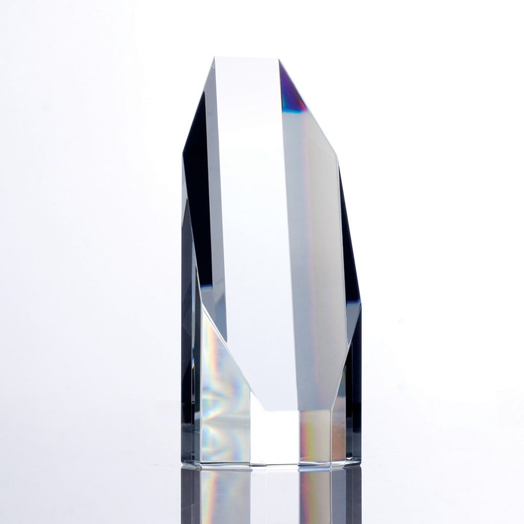 Clear crystal trophy with sharp angular facets on reflective base, ideal for corporate achievement or employee recognition awards.