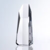 Crystal hexagon tower trophy with polished edges on a reflective surface, ideal for corporate or employee recognition awards.