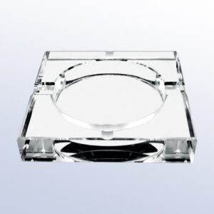 Clear acrylic crystal award with square shape, central circular engraving area, and four edge grooves for corporate recognition.