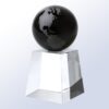 Crystal globe trophy with black and silver continents on clear glass pedestal, ideal for corporate achievement recognition.