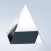 Clear crystal pyramid trophy with sharp edges on reflective surface, ideal for corporate or employee recognition awards.
