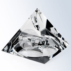 Crystal pyramid trophy with etched globe, ideal for corporate recognition or milestone awards, displayed on a white background.