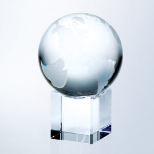 Crystal globe trophy with etched continents on a clear cube base, ideal for corporate or employee achievement awards.