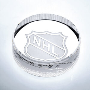 Crystal hockey puck trophy with engraved NHL logo, ideal for corporate or sports achievement recognition.