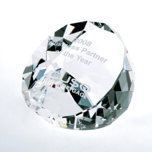 Faceted crystal award trophy inscribed with 2008 Business Partner of the Year and CUSO MORTGAGE on white background.