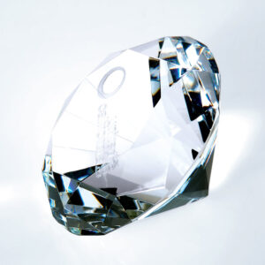 Diamond crystal trophy with faceted edges on white surface, ideal for corporate or employee achievement recognition.
