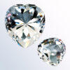 Heart-shaped clear crystal award trophy, faceted design, presented for corporate or employee recognition achievements.