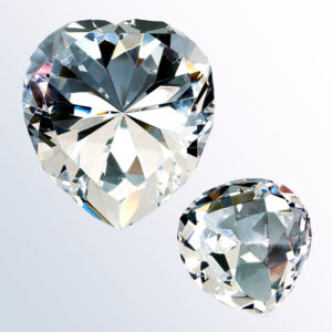 Heart-shaped clear crystal award trophy, faceted design, presented for corporate or employee recognition achievements.