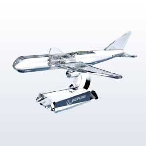 Crystal airplane trophy on glass stand with Boeing logo, ideal for corporate achievement or aviation milestone recognition.