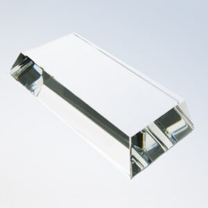 Rectangular crystal award trophy with triangular ends, clear glass, ideal for employee recognition or corporate achievement.