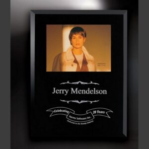 Crystal plaque with engraved portrait and text recognizing Jerry Mendelson for 20 years of service at Harms Software Inc.