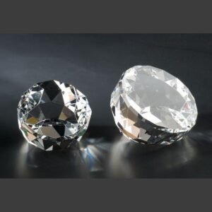 Faceted dome crystal award made of clear gemstone-like material, ideal for employee recognition or corporate achievement.