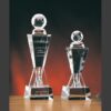 Victory Tower Crystal Award trophies with engraved text, ideal for corporate recognition, shown against a dark gradient background.