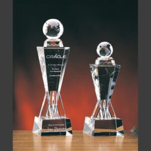 Victory Tower Crystal Award trophies with engraved text, ideal for corporate recognition, shown against a dark gradient background.
