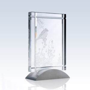Crystal plaque award with etched bird on branch, silver base; perfect for corporate recognition or milestone achievements.
