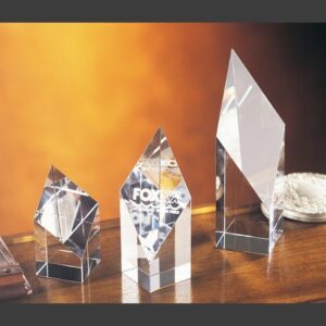 Deco Diamond Crystal Award and two glass trophies on wood, ideal for corporate or employee achievement recognition.
