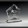 Crystal star award trophy on a rectangular base, engraved for corporate quarterly top performer recognition.