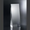 Clear rectangular crystal award with angled sides on a reflective base, ideal for corporate or employee recognition.