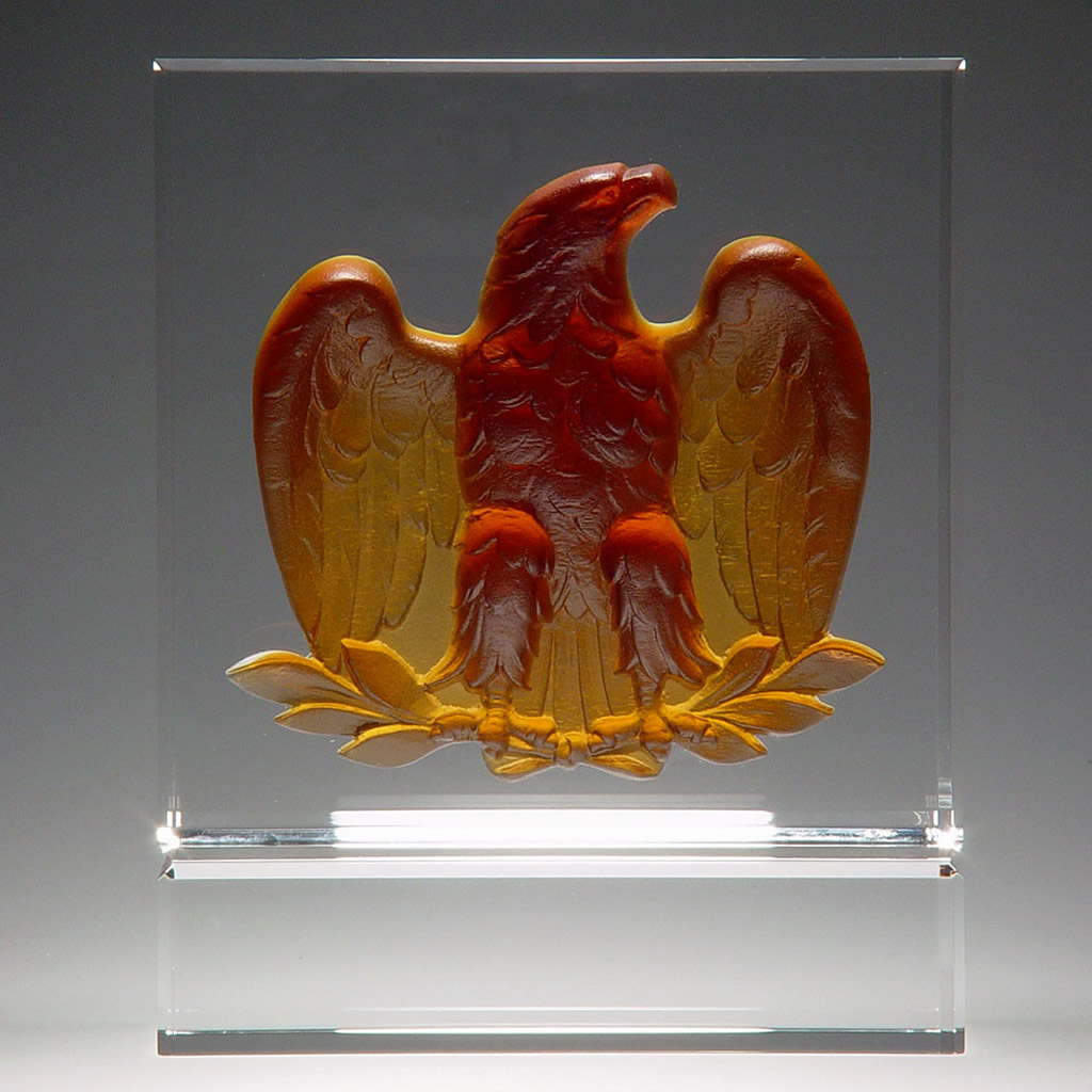 Amber crystal eagle plaque award on clear base, ideal for corporate recognition or employee achievement displays.