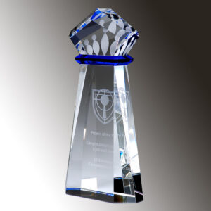 Crystal trophy with geometric faceted top, blue accent, and engraved front text, ideal for corporate recognition awards.