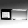 Crystal desk clock award with black and clear glass, featuring clock face at 8:10; ideal for corporate recognition.