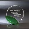 Crystal trophy with green base engraved for Outstanding Sales Leadership, ideal for corporate or employee recognition awards.