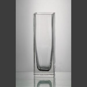 Rectangular crystal trophy on reflective surface, ideal for corporate or employee achievement recognition.