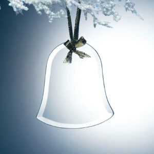 Crystal bell trophy with gold ribbon detail suspended from frosted branch, ideal for corporate recognition or milestone awards.