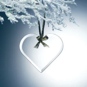 Crystal heart trophy with gold ribbon, hanging from a snowy branch; ideal for corporate or employee achievement recognition.