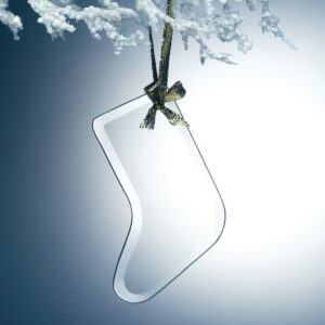 Crystal stocking-shaped award ornament on gold ribbon, hanging from snow-dusted branch; ideal for holiday recognition events.