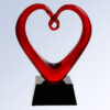 Red crystal heart trophy with twisted top on black base, ideal for corporate or employee achievement recognition.