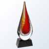 Crystal teardrop award with red, orange, and yellow swirl on black base; ideal for employee or corporate recognition.