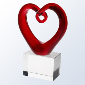 Crystal heart award on clear glass base, ideal for employee recognition or corporate milestone achievements.
