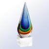 Teardrop art glass crystal award with blue, green, yellow, and orange layers on a clear base, ideal for corporate recognition.