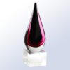 Teardrop-shaped crystal trophy with red and black accents on a clear glass base, ideal for corporate recognition awards.