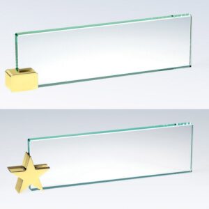 Blank crystal nameplates with brass holders—one with a gold cube, one star-shaped—ideal for corporate recognition awards.