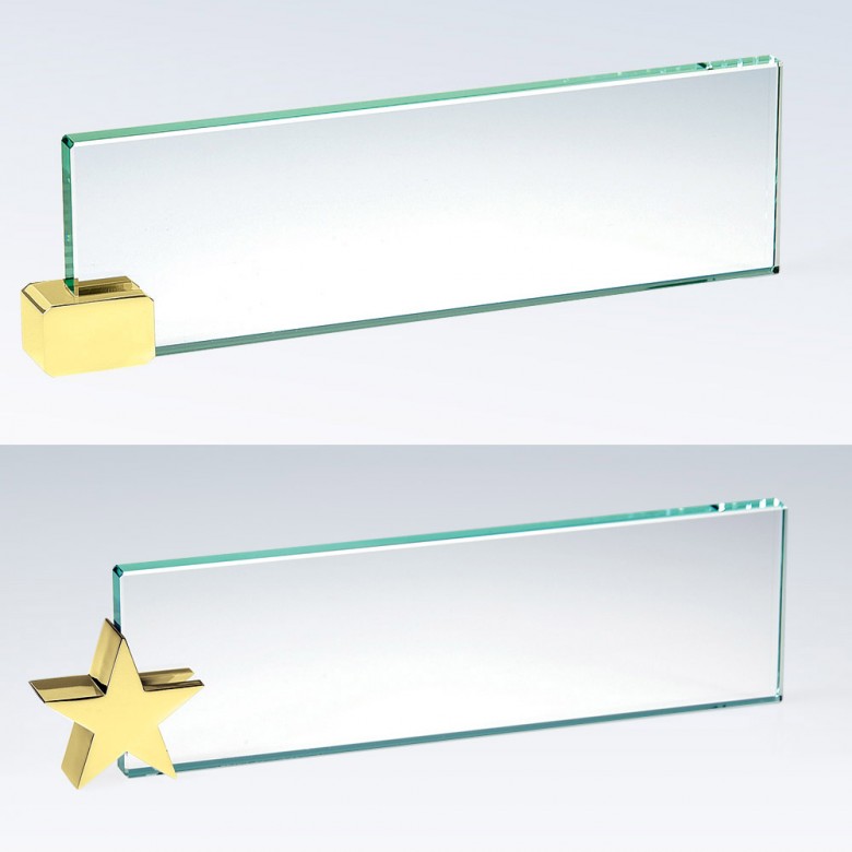 Blank crystal nameplates with brass holders—one with a gold cube, one star-shaped—ideal for corporate recognition awards.