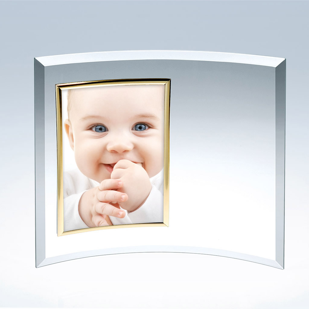 Crystal plaque featuring a baby portrait in a curved glass frame with gold border, displayed against a light background.