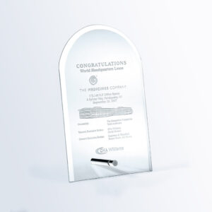 Crystal arch award with aluminum pole, engraved for corporate lease milestone recognition, includes ownership and broker details.