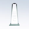 Crystal obelisk trophy on square base, engraved for corporate service recognition; clear glass with beveled edges.