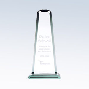Crystal obelisk trophy on square base, engraved for corporate service recognition; clear glass with beveled edges.
