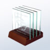 Crystal award coasters with etched dolphins and personalized text in a wooden holder, ideal for milestone recognition.