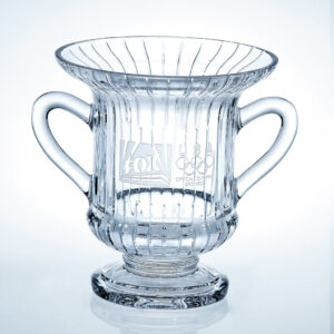 Crystal trophy cup with handles, ribbed design, and FOX/USA Olympic sponsor logos; ideal for corporate or achievement awards.