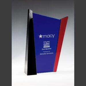 Crystal trophy with blue, black, and red accents; Macy logo; Excellence in Client Service award for employee recognition.