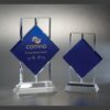 Crystal trophy awards with blue diamond centers on rectangular bases, ideal for corporate milestone or employee recognition.