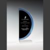 Crystal award plaque with blue edge, presented as a Top Producer corporate recognition on clear glass base.